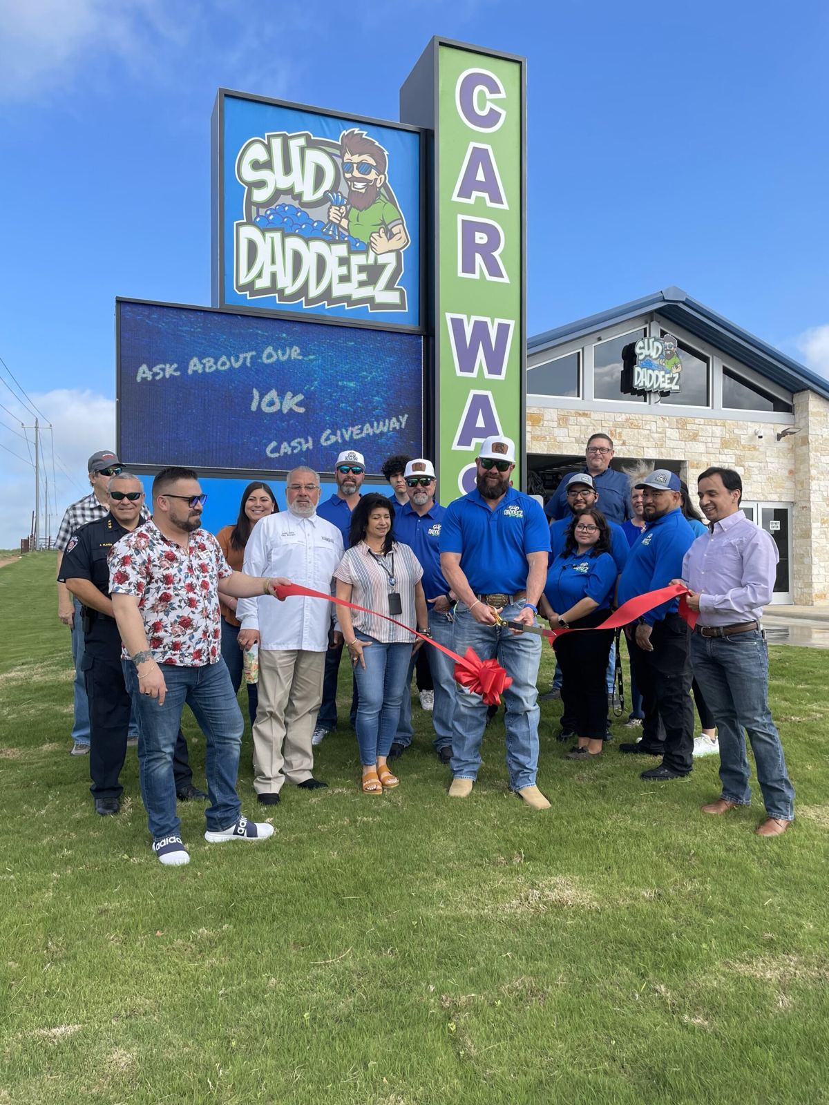 The Sud Daddee’z team at a ribbon cutting